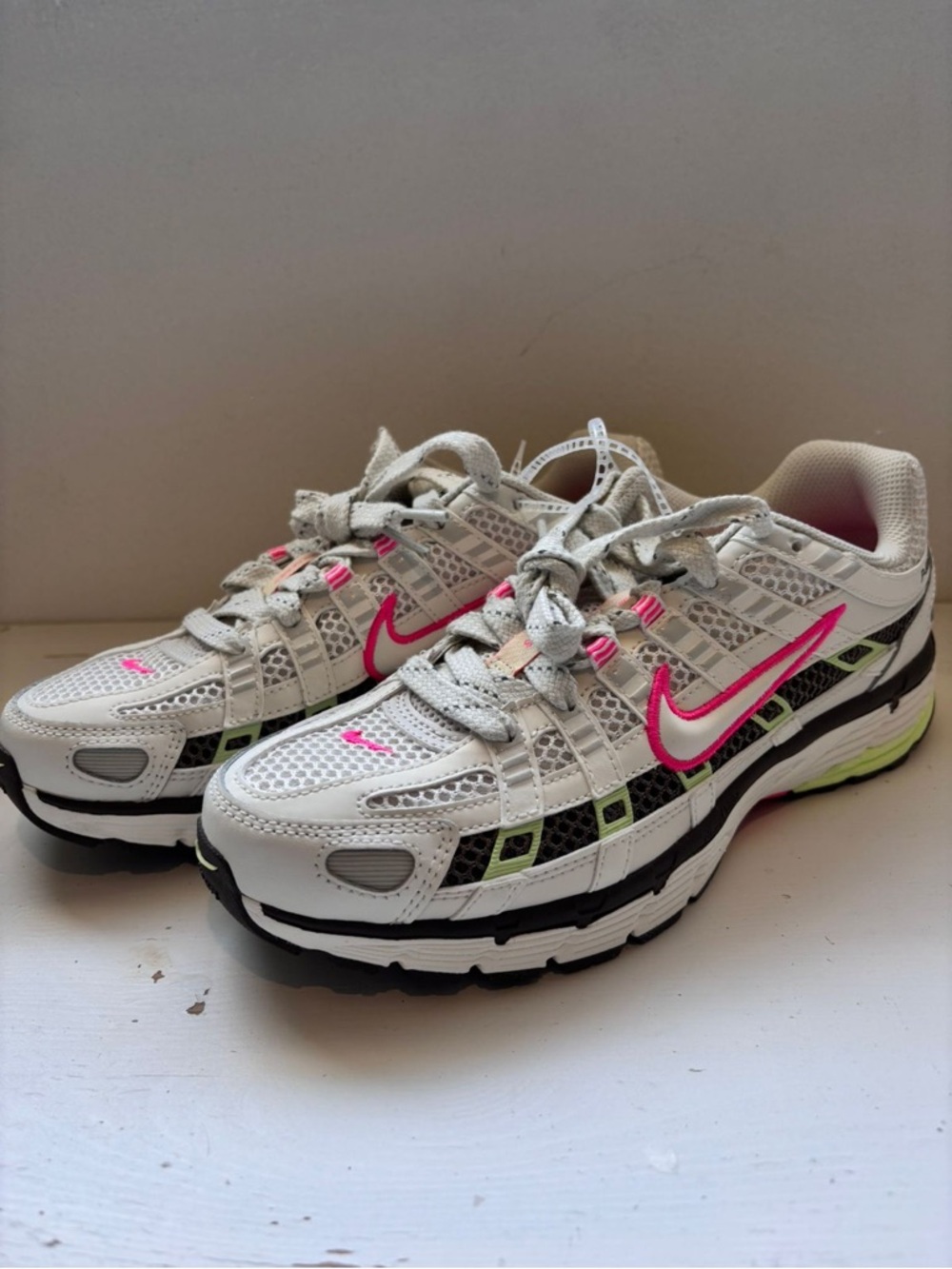 Nike Women’s White Sneakers with Pink Accents
